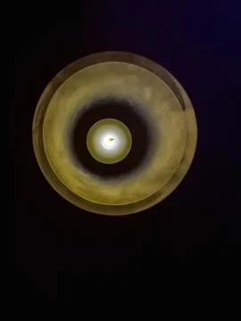 Lighted candle on black background with copy space. Stock Photos
