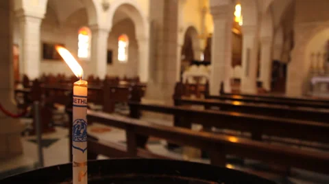 Lighted candle in church Stock Footage 32152595