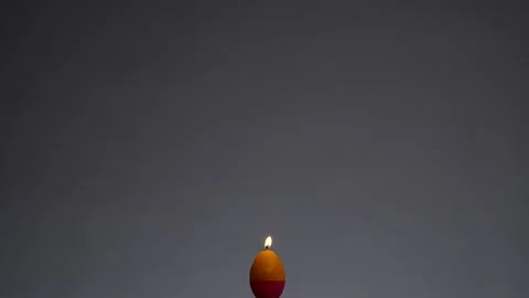 A lighted candle Stock Footage 132861662