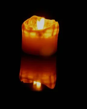 Lighted candle mirror effect Stock Photos