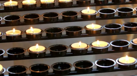 Lighted candles on the black display Stock Footage 53535207
