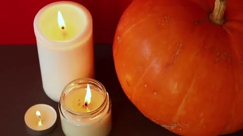 Lighted candles with pumpking on table. Halloween atmosphere, decoration Vídeo Stock 152446217
