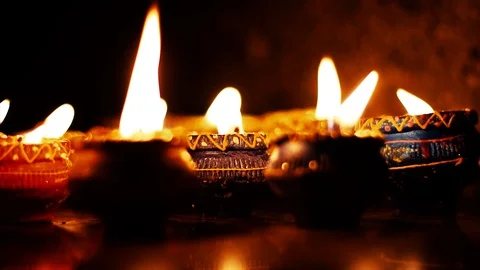 Lighted clay candle diya with selective focus and shallow depth of field in t Stock Footage 108740517