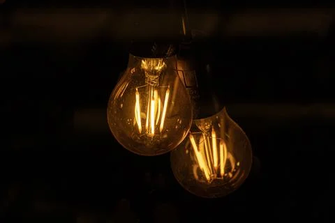 Lighted Halogen lamp on black background Stock Photos