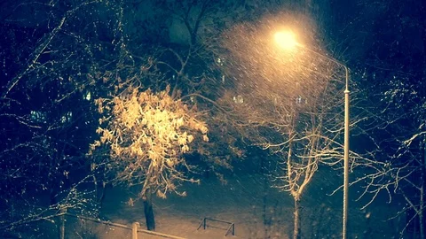 Lighted Lantern at Night in Winter. Snowfall. Stock Footage 71058888