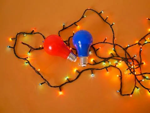 Lighted lanterns for illumination, bulbs red and blue Stock Photos