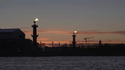 Lighted Rostral columns at sunset. St. Petersburg, Vasilievsky island. Stock Footage 130046689