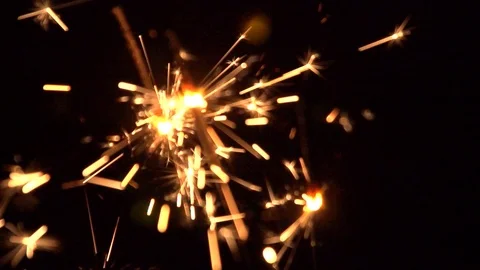 Lighted sparklers on black background Video stock 121719393