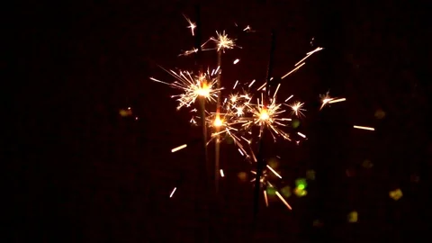 Lighted sparklers on black background Stock Footage 121719403