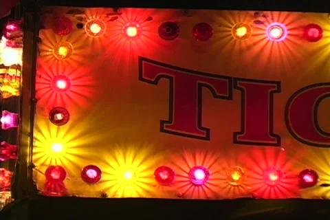 Lighted Ticket Booth at a Carnival pan right Stock Footage 565771