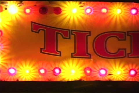 Lighted Ticket Booth at a Carnival pan and zoom Stock Footage 565776