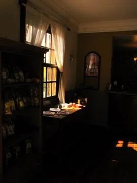 Lighted window of a coffee bar Stock Photos