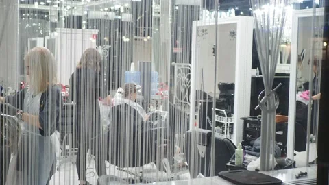 The lighted window of the salon where stylists do hairstyles for clients. Stock-Footage 166987661