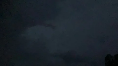 Lightening flashes in night sky, two bolts, clouds visisble Stock Footage 286167936