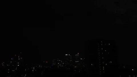 Lightening strikes from a supercell thunder storm passing over Canary Wharf at Stock Footage 91260237