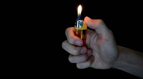 Lighter Against Black Background Stock Footage 50746437