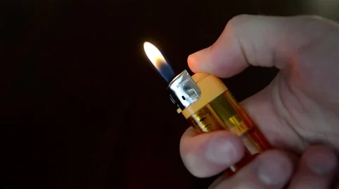 Lighter Against Dark Background Stock Footage 50746335