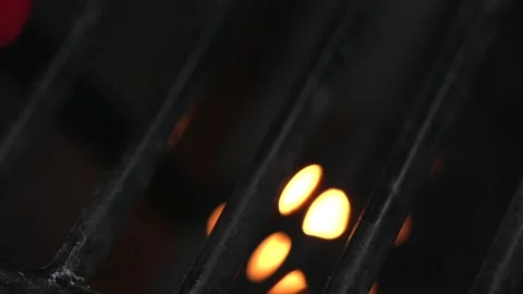 Lighter attempts to light gas grill close up macro Stock Footage 197164232