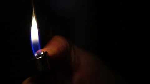 Lighter being lit and turned off Video stock 234345672