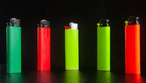 Lighter on a black background Stock Photos