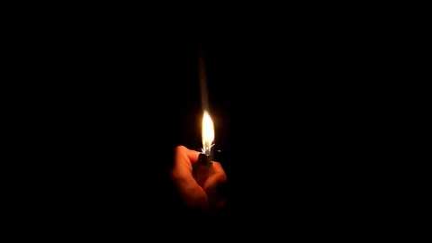Lighter burns in the dark. Slow motion. Stock Footage