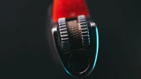 Lighter on a dark background rotates in macro Stock Footage 171039670