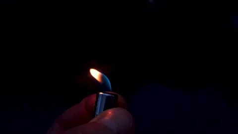 Lighter flame in the dark of night, hiking, survival, burning fire lighter. Stock Footage 306976916