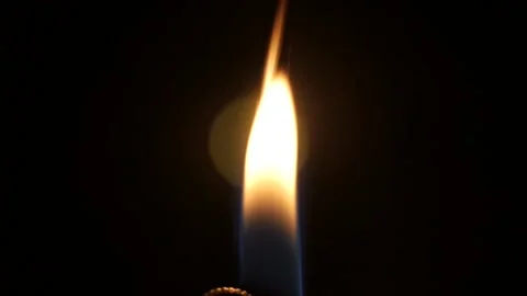 Lighter Flame at night on a table Stock Footage 132011804