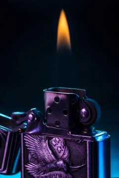 Lighter with flame Stock Photos