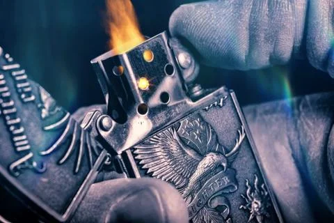 Lighter in hand Stock Photos