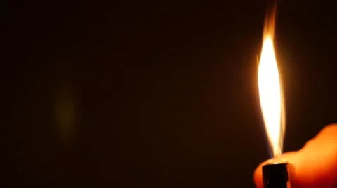 Lighter ignition in dark sequence slow motion l Stock Footage 56786994