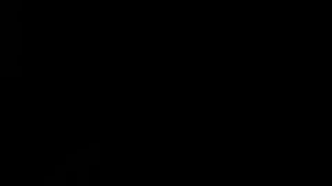 Lighter lights up against a black background in slow motion Stock Footage 81906930