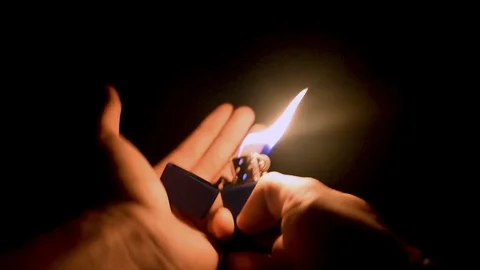 Lighter at night Stock Footage 129767806