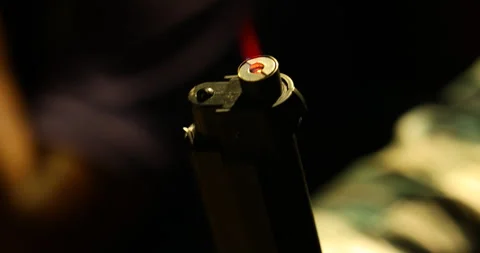 Lighter Revolver in a hand Stock Footage 289630756