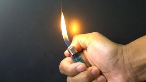 Lighter in slow motion Lighter Being Lit in the Dark Stock Footage 120463392