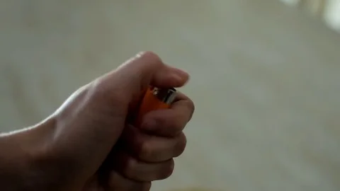 Lighter turning on hand Stock Footage 76928590