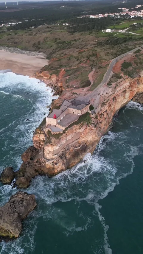 The lighthouse above Nazare -  VERTICAL Stock Footage 233117387