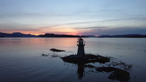 Lighthouse aerial shot at sunset Stock Footage 218255027