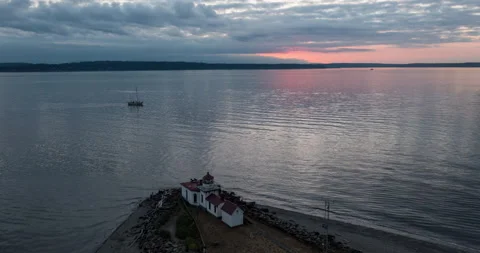 Lighthouse aerial time lapse at sunset with boat Video stock 165257614