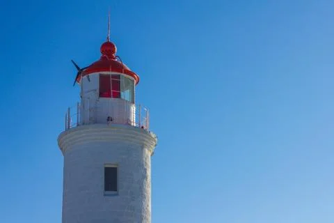 A lighthouse against the sky. Stock Photos