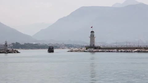 Lighthouse of Alanya against the backdrop of the mountains. Alanya Stock Footage 200900545