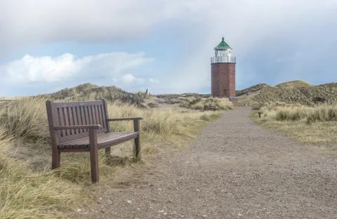 Lighthouse and bench Stock Photos