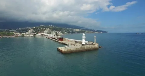 Lighthouse And Breakwater At The Harbour Video stock 63632624