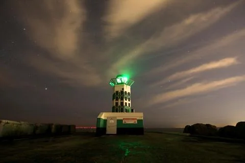 Lighthouse and clouds Stock Photos