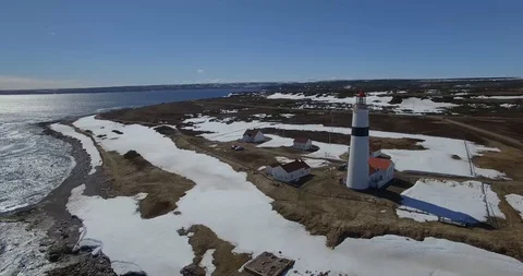 LIGHTHOUSE AND COASTLINE L'ANSE AMOUR LABRADOR BY DRONE Stock Footage 90758924