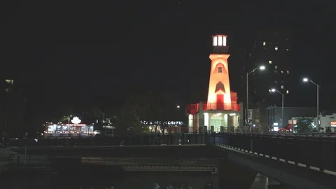 Lighthouse and harbour at night Stock Footage 117461264