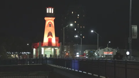 Lighthouse and harbour at night Stock Footage 117461265