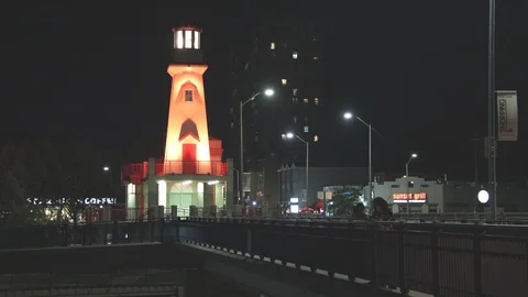 Lighthouse and harbour at night Stock Footage 117461378