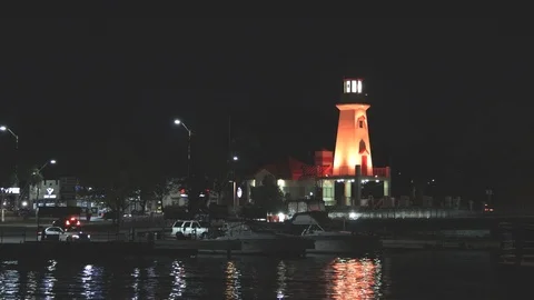 Lighthouse and harbour at night Stock Footage 117461403