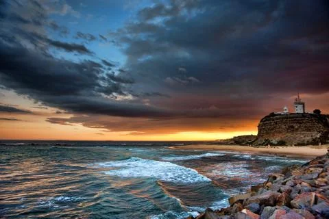 Lighthouse and ocean sunset Stock-Fotos